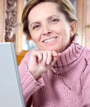 A smiling older woman with dentures